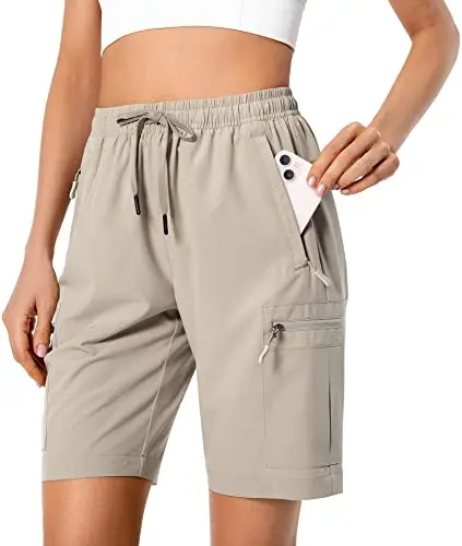 Women's lightweight hiking cargo shorts showing five zipper pockets and water-resistant fabric