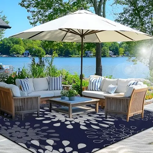 Wallona floral outdoor rug in blue and white on grass